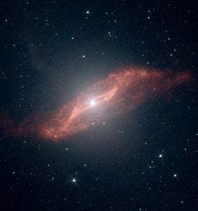 Centaurus A in mid-infrared showing trapezoidal remains of spiral galaxy falling in